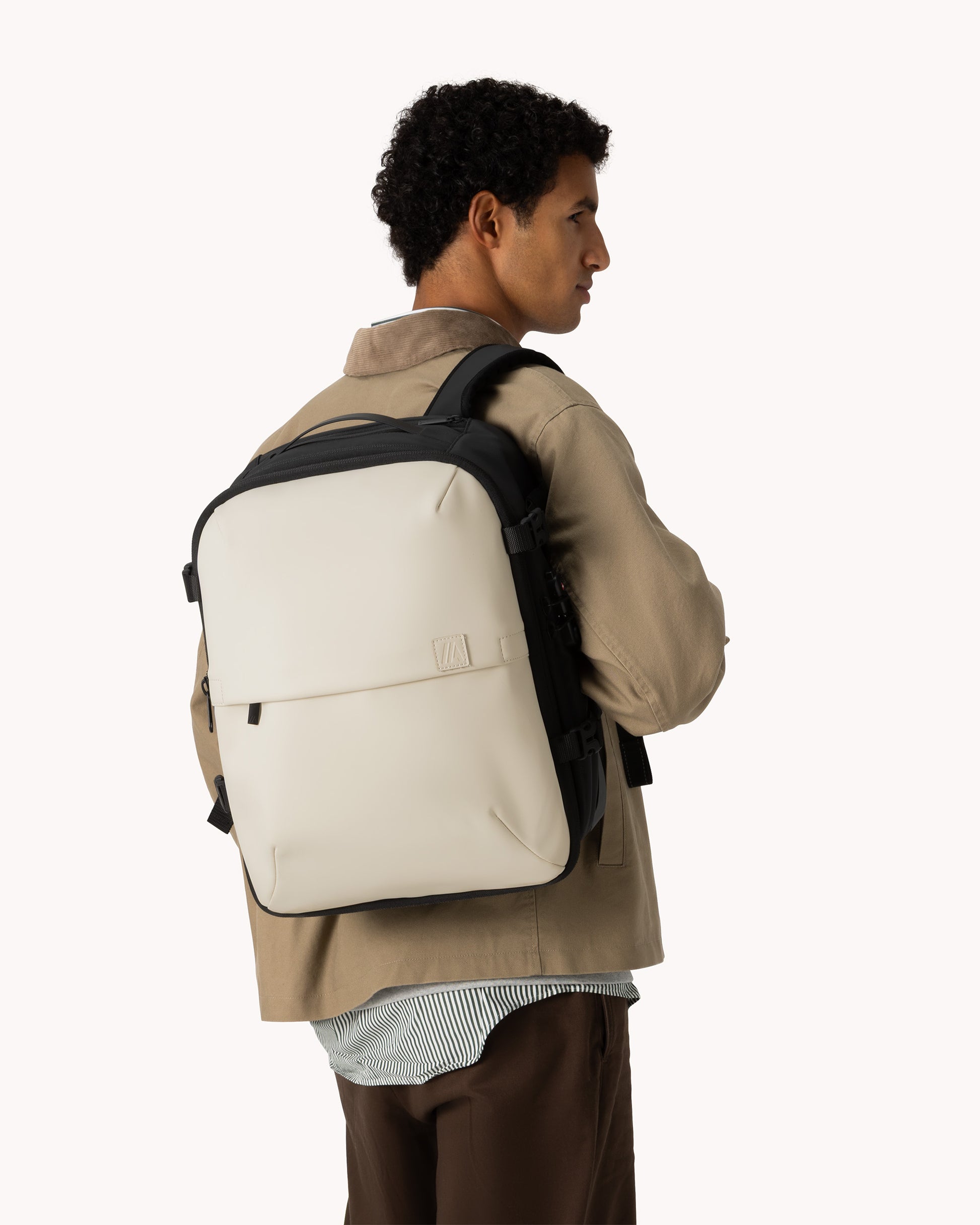 best travel backpack for men under seat Vacuum Backpack with Wheels (Under-Seat) – Light Sand | Airback
