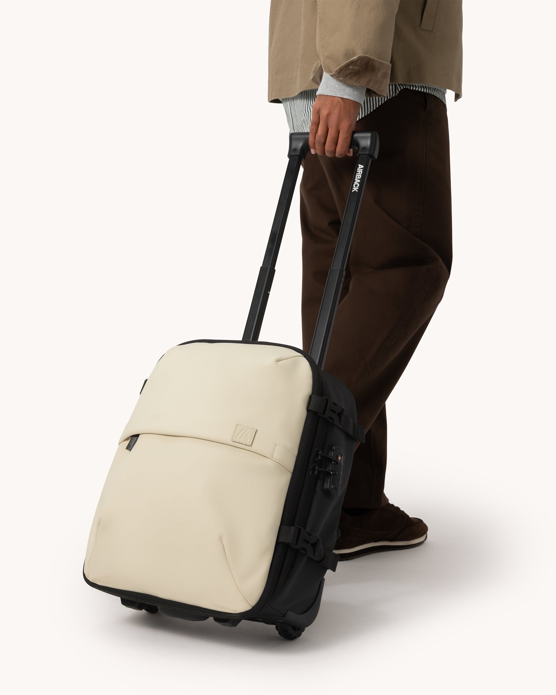 best laptop backpack airplane travel under seat bag Vacuum Backpack with Wheels (Under-Seat) – Light Sand | Airback
